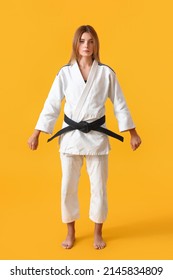 Female Karate Instructor On Color Background