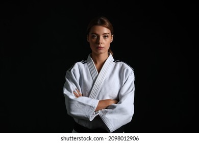 Female Karate Instructor On Dark Background