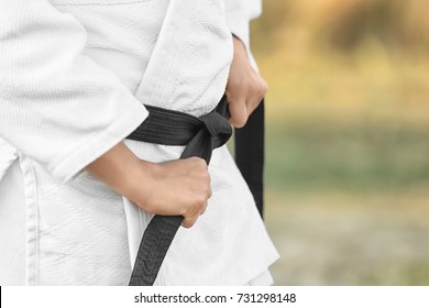 Female karate instructor outdoors, closeup - Powered by Shutterstock