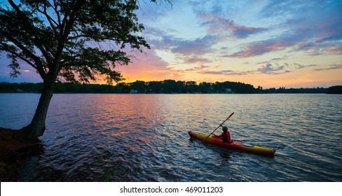 Female Kayaker on Lake Keowee at Sunset - Powered by Shutterstock