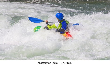 Female kayaker in the white water of tghe river - Powered by Shutterstock