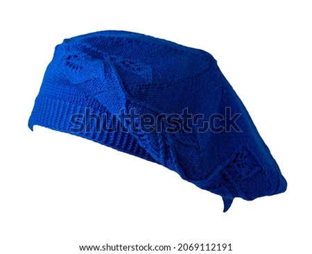 female knitted blue beret isolated on white background. autumn accessory