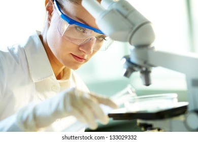 Female Lab Worker Experimenting With Substances To Find New Formula