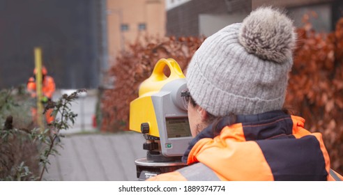 Female Land Surveyor Operating A Digital Precision Measurement Level To Establish Or Verify Or Measure The Height Of Specified Points Relative To A Datum. Copenhagen, Denmark - January 7, 2020.