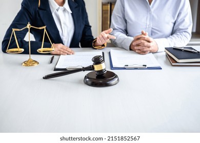 Female Lawyer Or Counselor Working In Courtroom Have Meeting With Client Are Consultation With Contract Papers Of Real Estate, Law And Legal Services Concept.