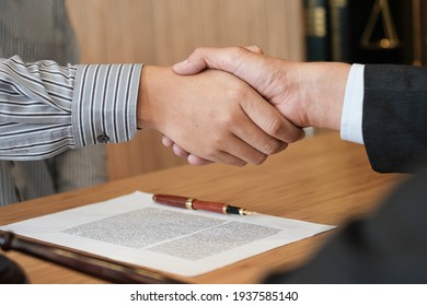 Female Lawyer Handshake With Client. Business Partnership Meeting Successful Concept