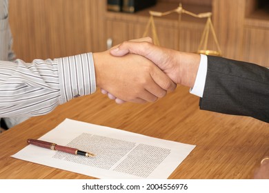 Female Lawyer Handshake With Client. Business Partnership Meeting Successful Concept