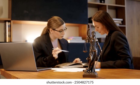 A female lawyer at her workplace communicates with a young client, discussing issues of legal significance. Consultation concept with legal - Powered by Shutterstock