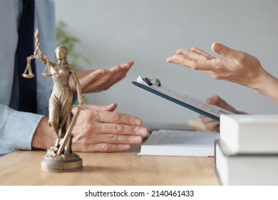 a female lawyer at a meeting with a male client in the office of the law office, legal advice online. resolution of disputes of the family code during divorce and division of property. work as a - Shutterstock ID 2140461433