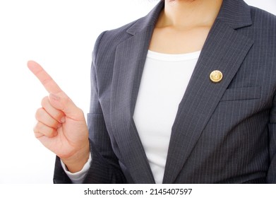 A female lawyer raising her index finger