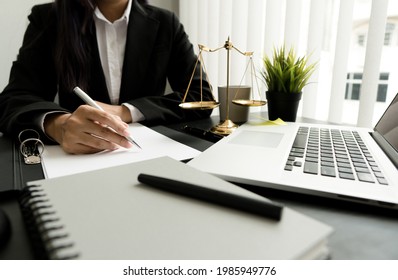 Female Lawyer Working With Contract Papers And Wooden Gavel On Table In Courtroom. Justice And Law ,attorney, Court Judge, Concept.