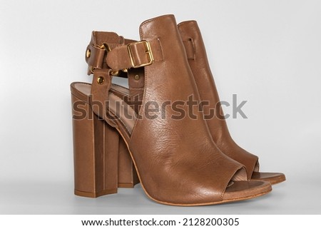Female leather high heeled ankle sandals. Women's footwear.