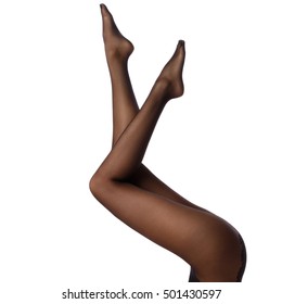 Female Legs In Black Pantyhose On White Background