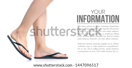 Female legs with flip flops on white background isolation