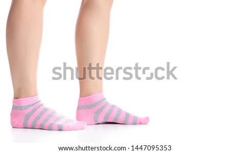 Female legs with pink socks fashion on background isolation