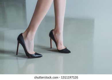 Female legs in shoes with very high heels - Shutterstock ID 1311197135