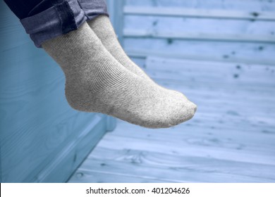 Female Legs In Woolen Socks