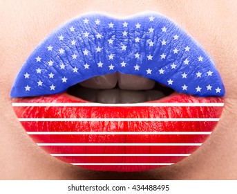 Female Lips Close Up With A Picture Flag Of USA.