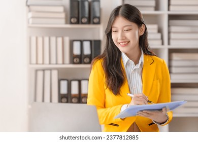Female loan service providers asian people business professionals ensuring easy loan processes, working diligently, guiding clients through financial pathways, and mapping success.