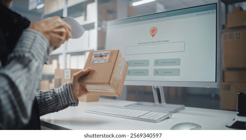 Female Logistics Specialist Scans Code on Cardboard Box with Scanner, Checks Parcel Information. Computer Screen Shows Delivery Tracking System for Monitoring Package with Online Orders. Close Up.
