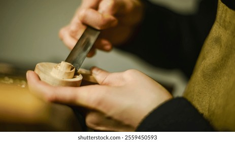 Female luthier meticulously carving a piece of wood with a chisel, creating a crucial component for a violin, showcasing the craftsmanship and precision involved in the art of violin making - Powered by Shutterstock