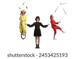 Female magician standing in front of a clown and juggler isolated on white background