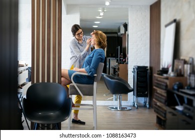 Female make up artist working on model in salon - Shutterstock ID 1088163473