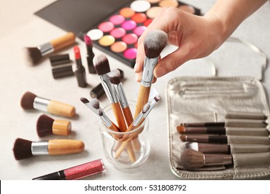 Female Makeup Artist Hand With Professional Brush At Work