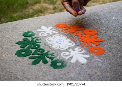 Female Making Rangoli Design Of Tricolored Design Saffron White And Green On Occasion Of Indian Republic Day Eve Celebration