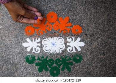 Female Making Rangoli Design Of Tricolored Design Saffron White And Green On Occasion Of Indian Republic Day Eve Celebration