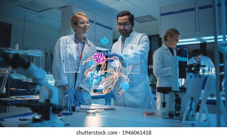 Female and Male Medical Research Scientists Use Futuristic Virtual Interface of a Gene Editing Software in a Modern Science Laboratory. Concept of Using Futuristic Technologies. - Powered by Shutterstock