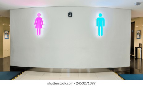 Female and male toilet sign on the exterior of a public restroom entrance. Two doors to the public toilet for women and men. Indicative sign for toilet for men and women.