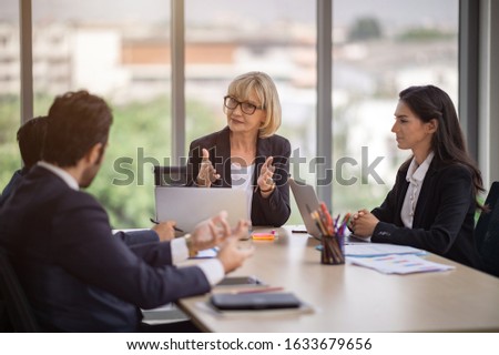female manager explained the working principles for the work members