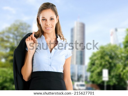 Female manager holding her jacket outdoor