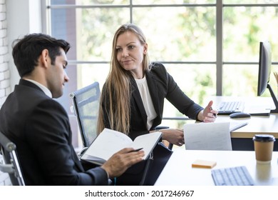 Female Manager Informing New Employees Of Company Rules During Probation Period