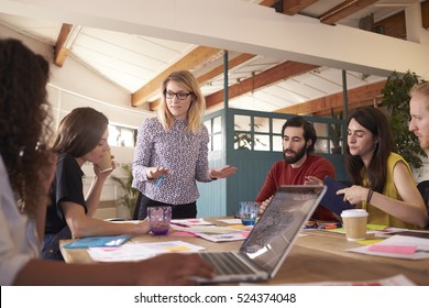 Female Manager Leads Brainstorming Meeting In Design Office - Powered by Shutterstock