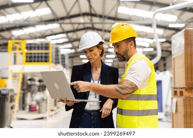 Female manager talking with foreman, checking production plan on notebook. Woman quality controller checking quality of products, talking with technician. - Powered by Shutterstock