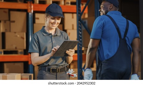 Female Manager Using Tablet Computer To Check Inventory. Warehouse Retail Center with Cardboard boxes,  e-Commerce Online Orders, Food. Frontline Hero.