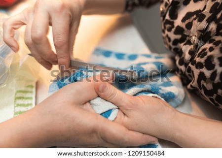 Similar – Caregiver checking blood pressure to a senior woman