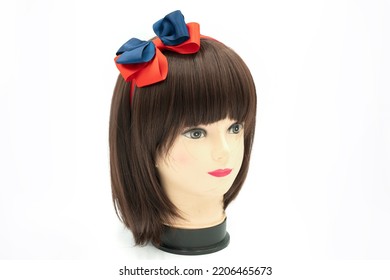 Female Mannequin With Hair Band Of Colored On Head. High Quality Photo