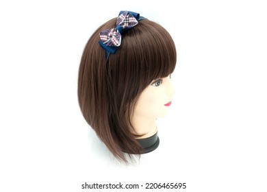 Female Mannequin With Hair Band Of Colored On Head. High Quality Photo