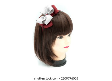 Female Mannequin With Hair Band Of Colored On Head. High Quality Photo