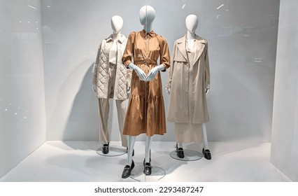 Female mannequins in shop window. Three women dummies show fashionable clothes - Shutterstock ID 2293487247