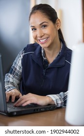 Female Manual Worker Using A Laptop