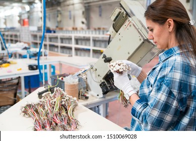 Female Manual Worker Working At A Factory