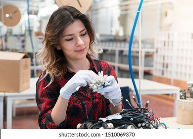 Female Manual Worker Working At A Factory