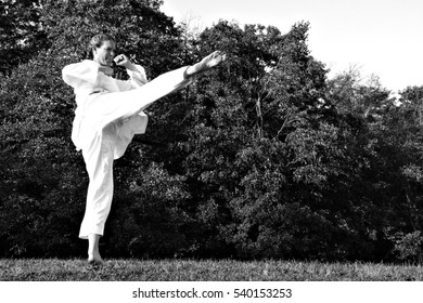 Female Martial Artist Practicing Outdoors 