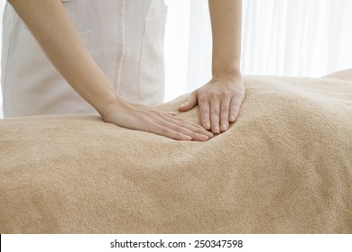 Female masseuse - Shutterstock ID 250347598