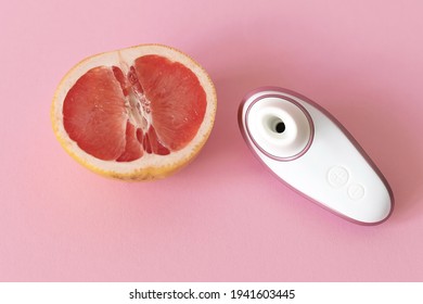 Female Masturbation Concept, Grapefruit And Sex Toy On The Table. High Quality Photo