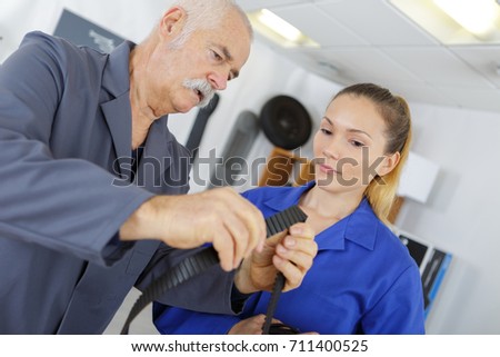 female mechanic with teacher